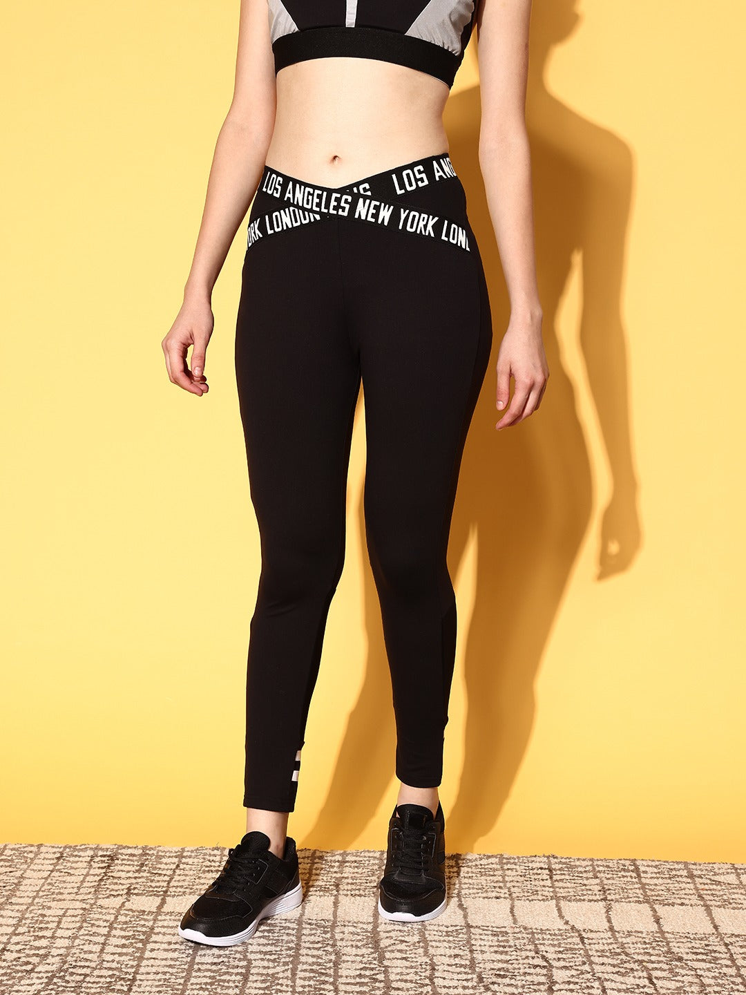 Berrylush Women Solid Black Typography Criss-Cross Elastic High-Rise Waist  Slip-On Regular Sports Tights
