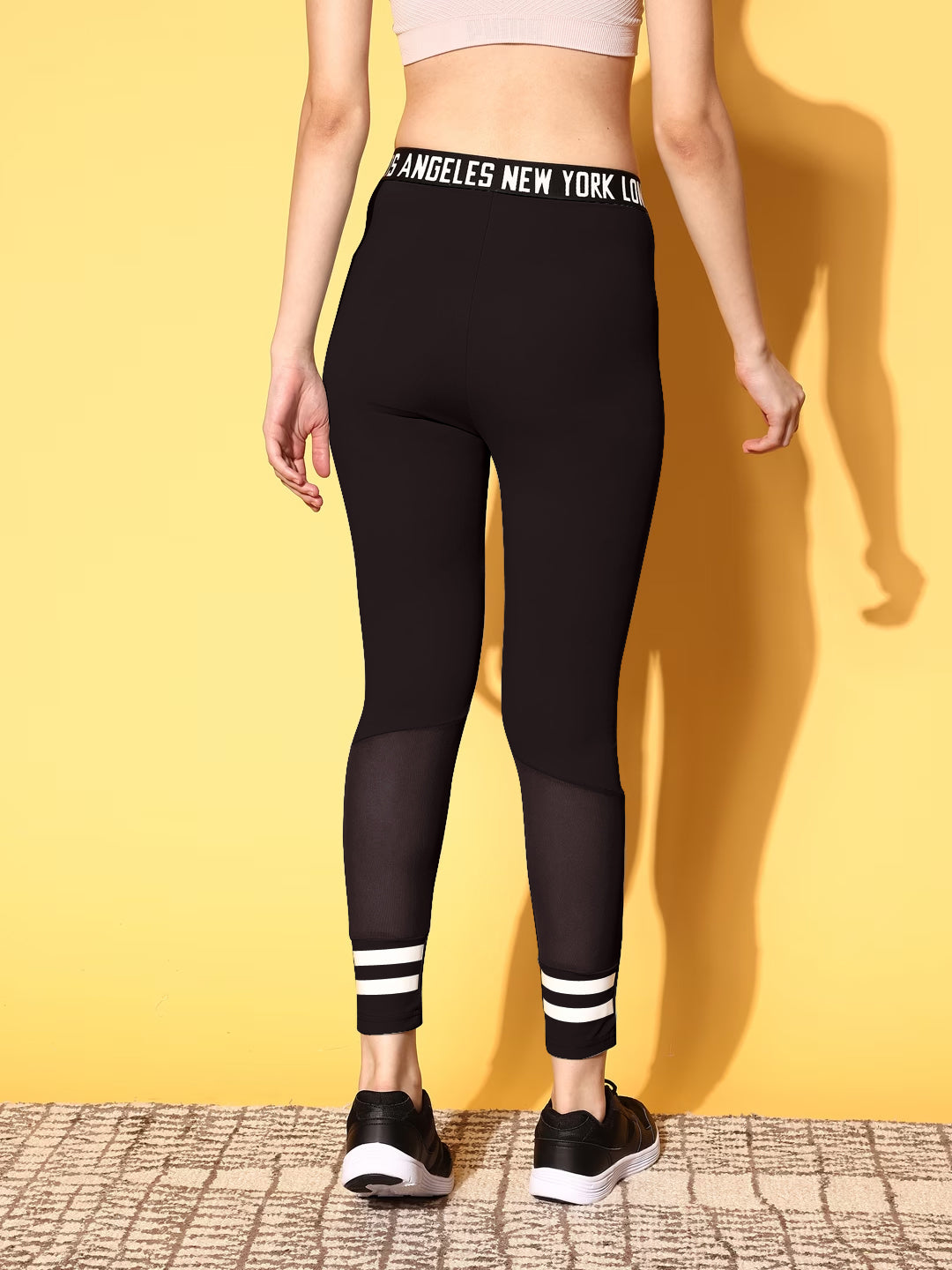 Berrylush Women Solid Black Typography Criss-Cross Elastic High-Rise Waist Slip-On Regular Sports Tights