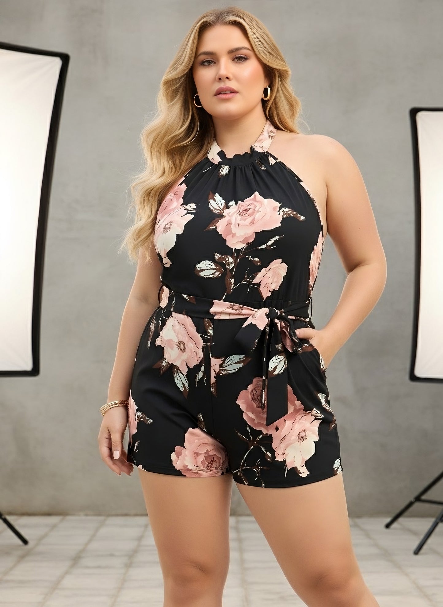 Berrylush Curve Women Black & Pink Floral Printed Halter Neck Sleeveless Waist Tie-Up Backless Pleated Mini Jumpsuit