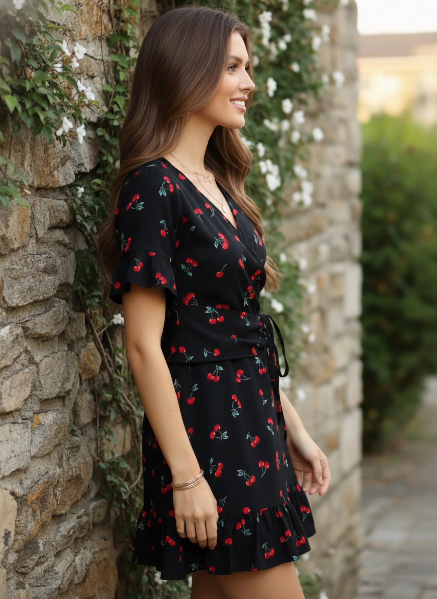 Berrylush Women Black & Red Cherry Printed V-Neck Waist Tie-Up Flounce Hem Fit & Flare Wrap Mini Dress
