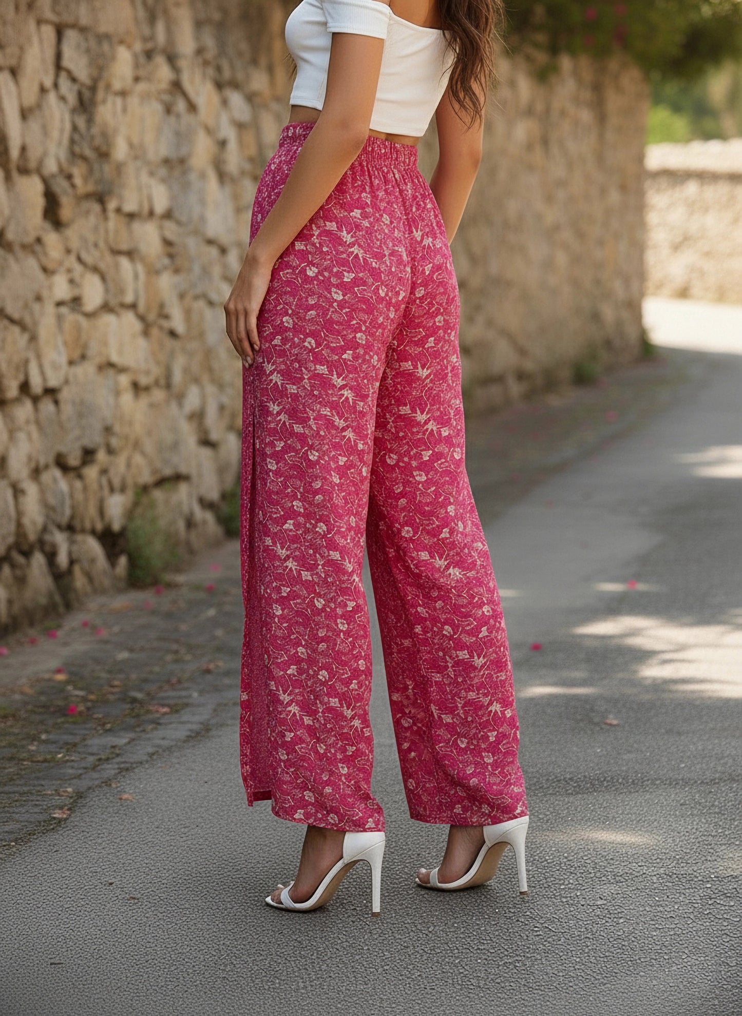Berrylush Women Pink & White Floral Printed Mid-Rise Tie-Up Waist Side-Slit Tapered Regular Trousers