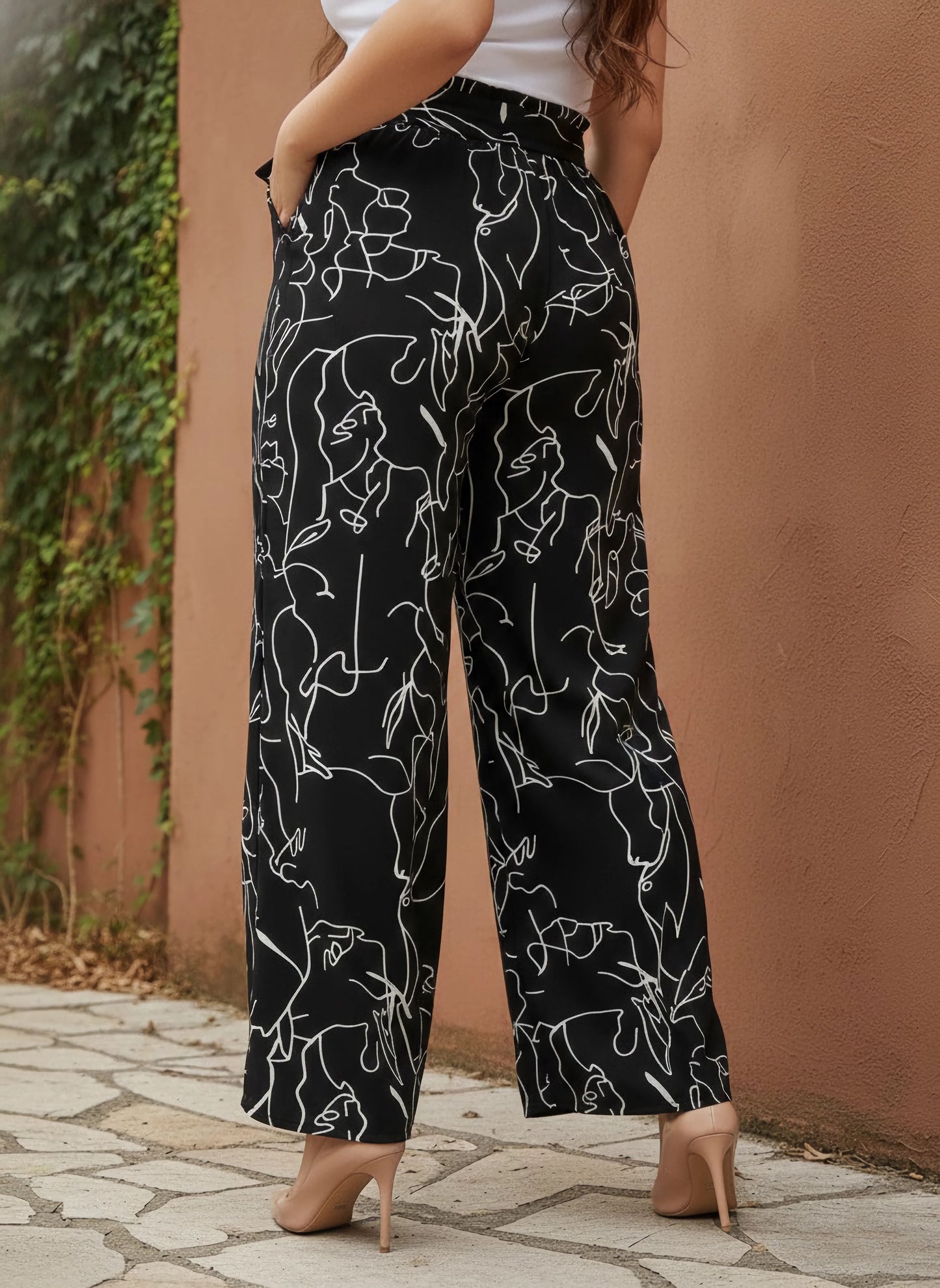 Berrylush Curve Women Black & White Abstract Printed High-Rise Tie-Up Waist Slip-On Flared Regular Trousers