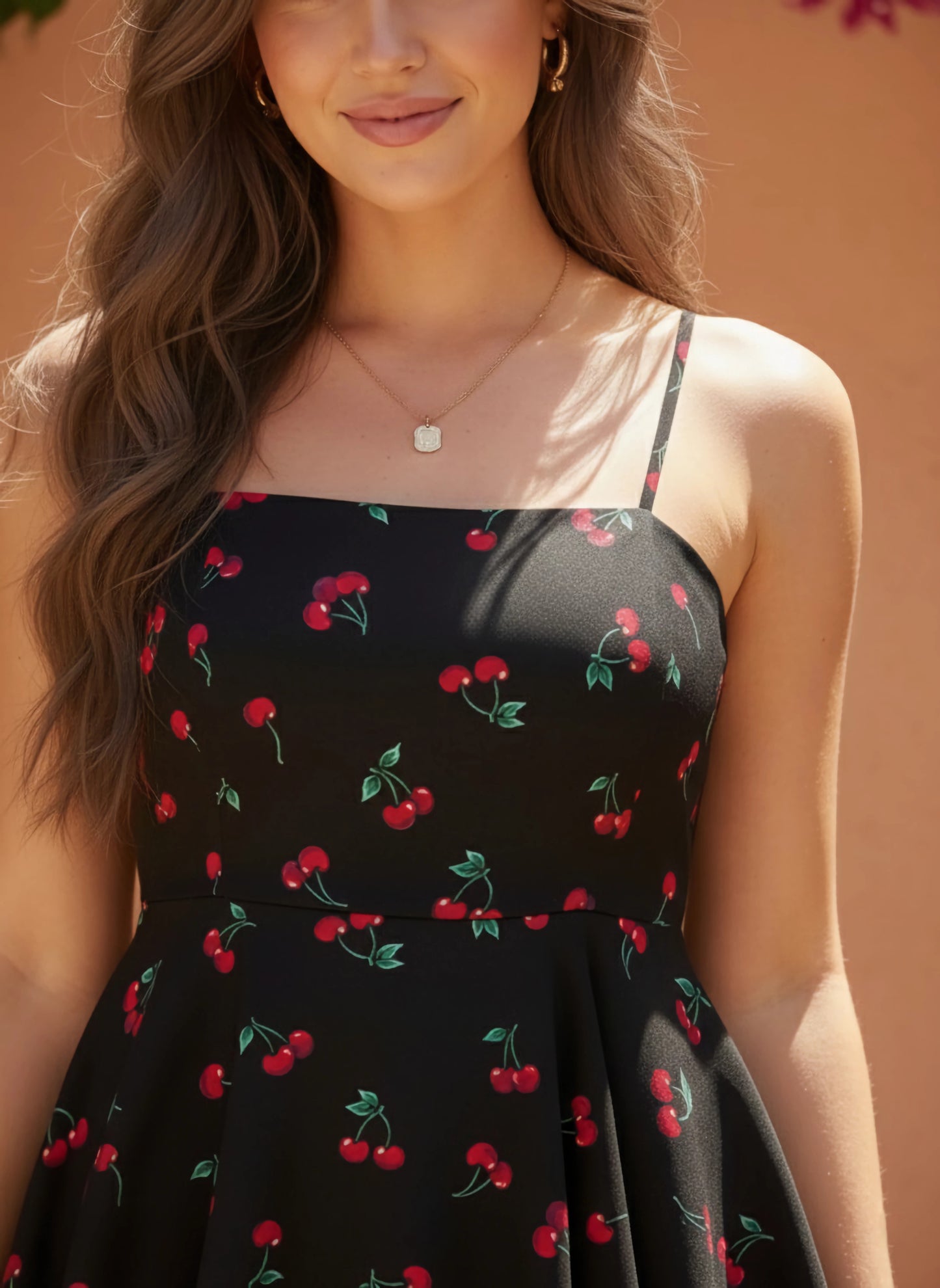 Berrylush Women Black & Red Cherry Printed V-Neck Sleeveless Back Tie-Up Cutout Layered Mini Jumpsuit