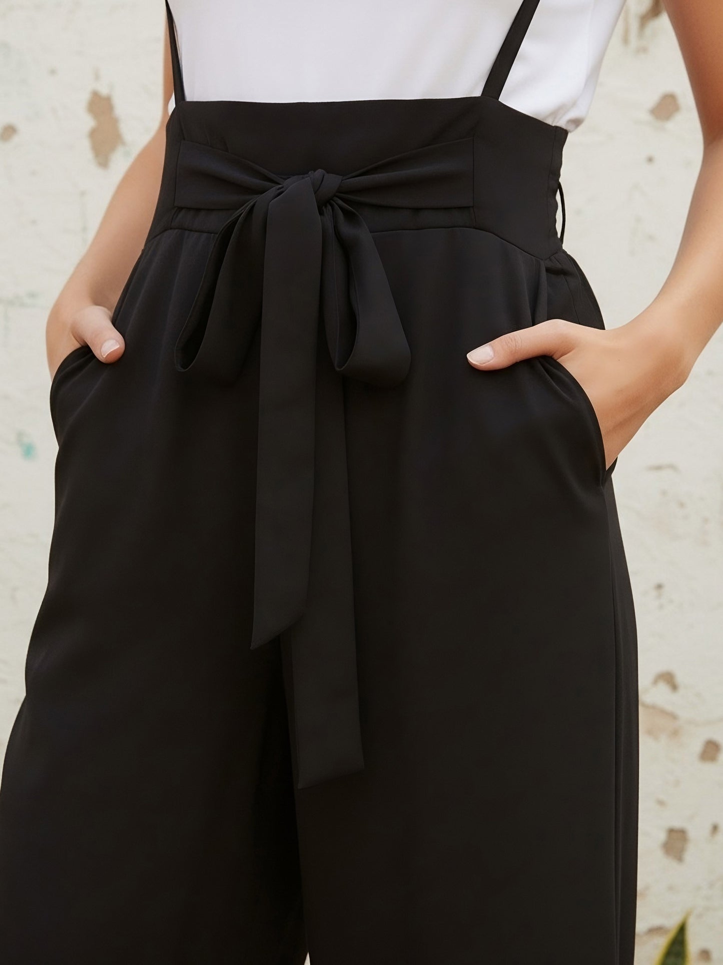 Berrylush Women Solid Black Smocked Back Tie-Up Capri Jumpsuit