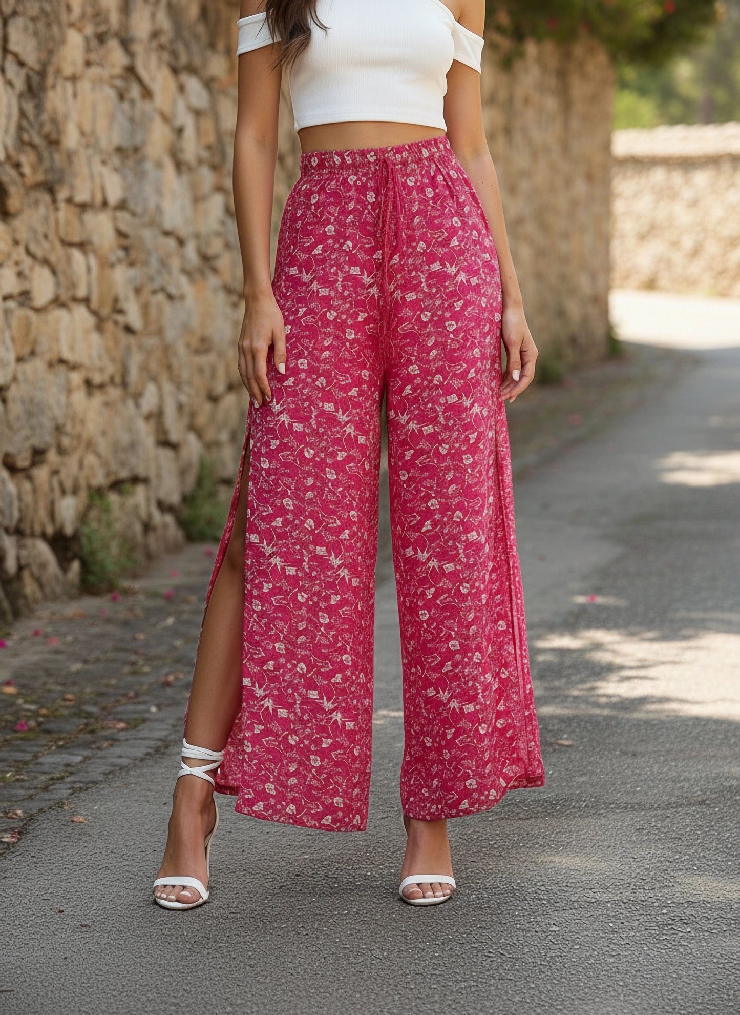 Berrylush Women Pink & White Floral Printed Mid-Rise Tie-Up Waist Side-Slit Tapered Regular Trousers