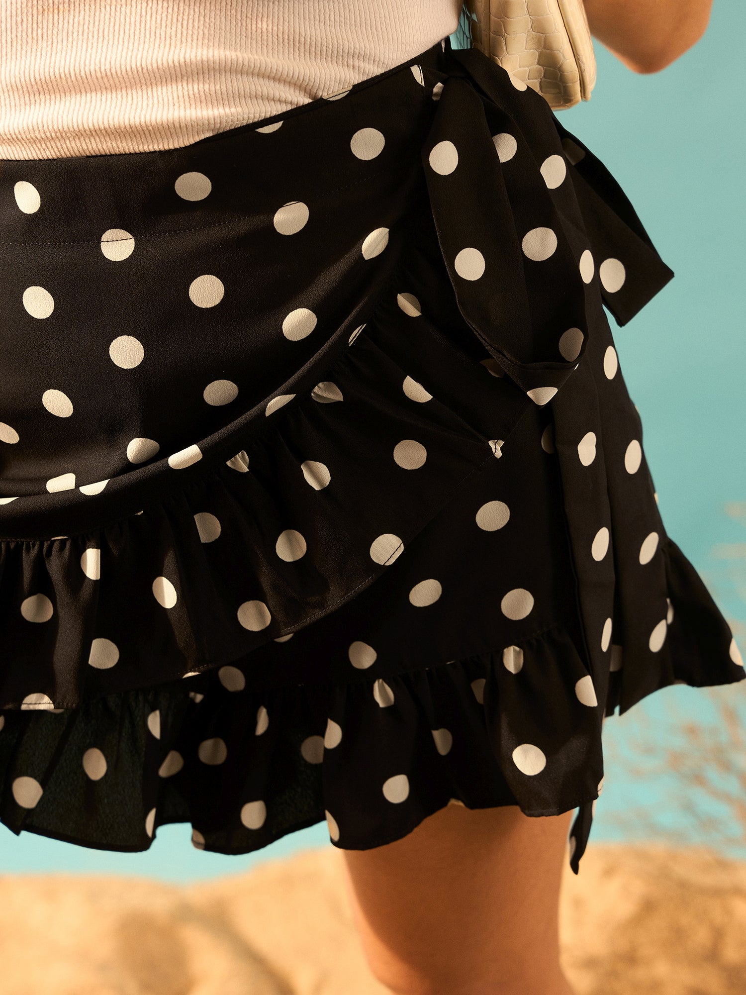Berrylush Women Black & White Polka Dot Printed High-Rise Tie-Up Waist Tulip Hem Wrap Ruffled Mini Shorts