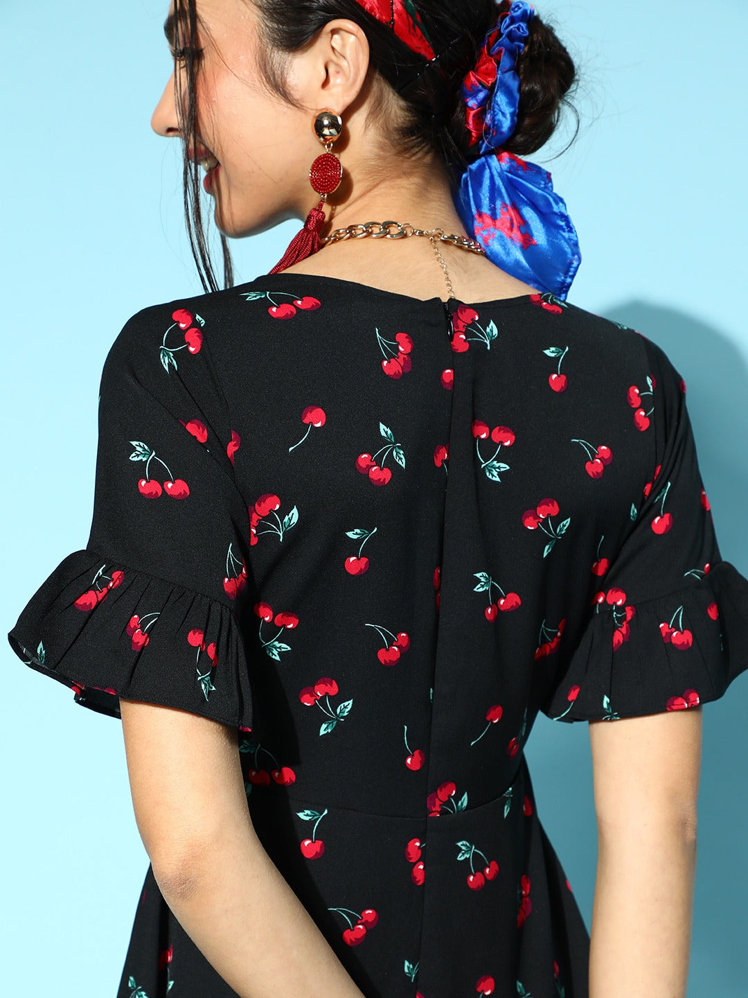 Berrylush Women Black & Red Cherry Printed V-Neck Waist Tie-Up Flounce Hem Fit & Flare Wrap Mini Dress